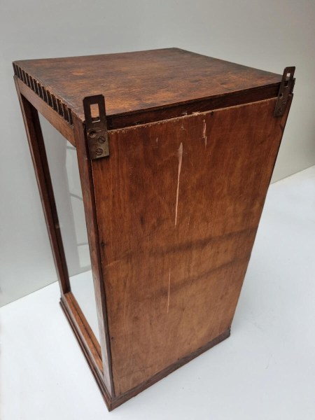 Back view of Amsterdam School oak hanging cabinet showing metal mounting hooks